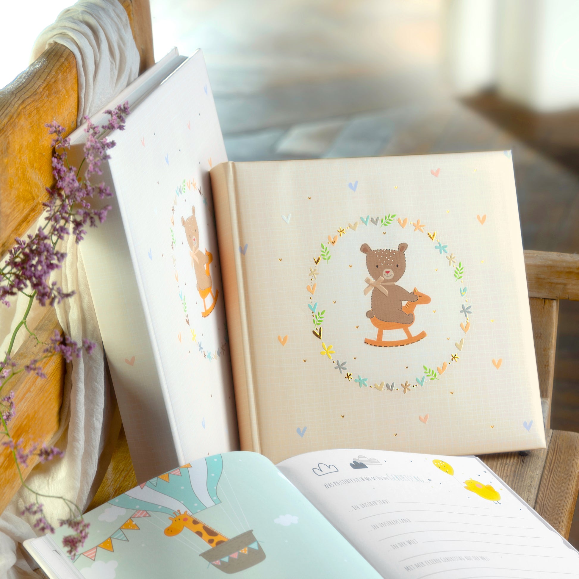 A delightful Goldbuch baby photo album showcasing a bear on a rocking horse, ideal for storing treasured childhood moments.