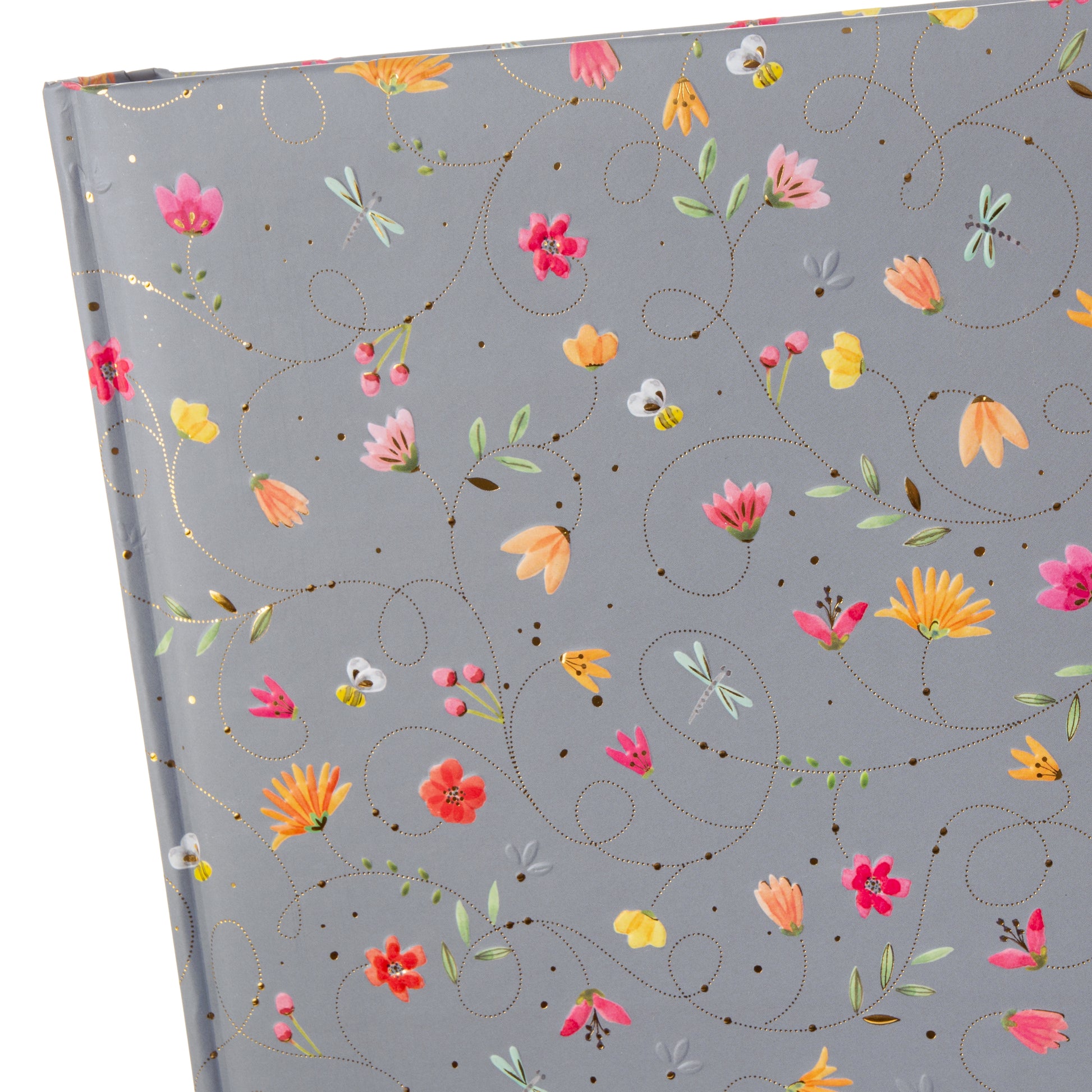 A grey Goldbuch photo album notebook adorned with vibrant flowers, showcasing creativity and personal expression.