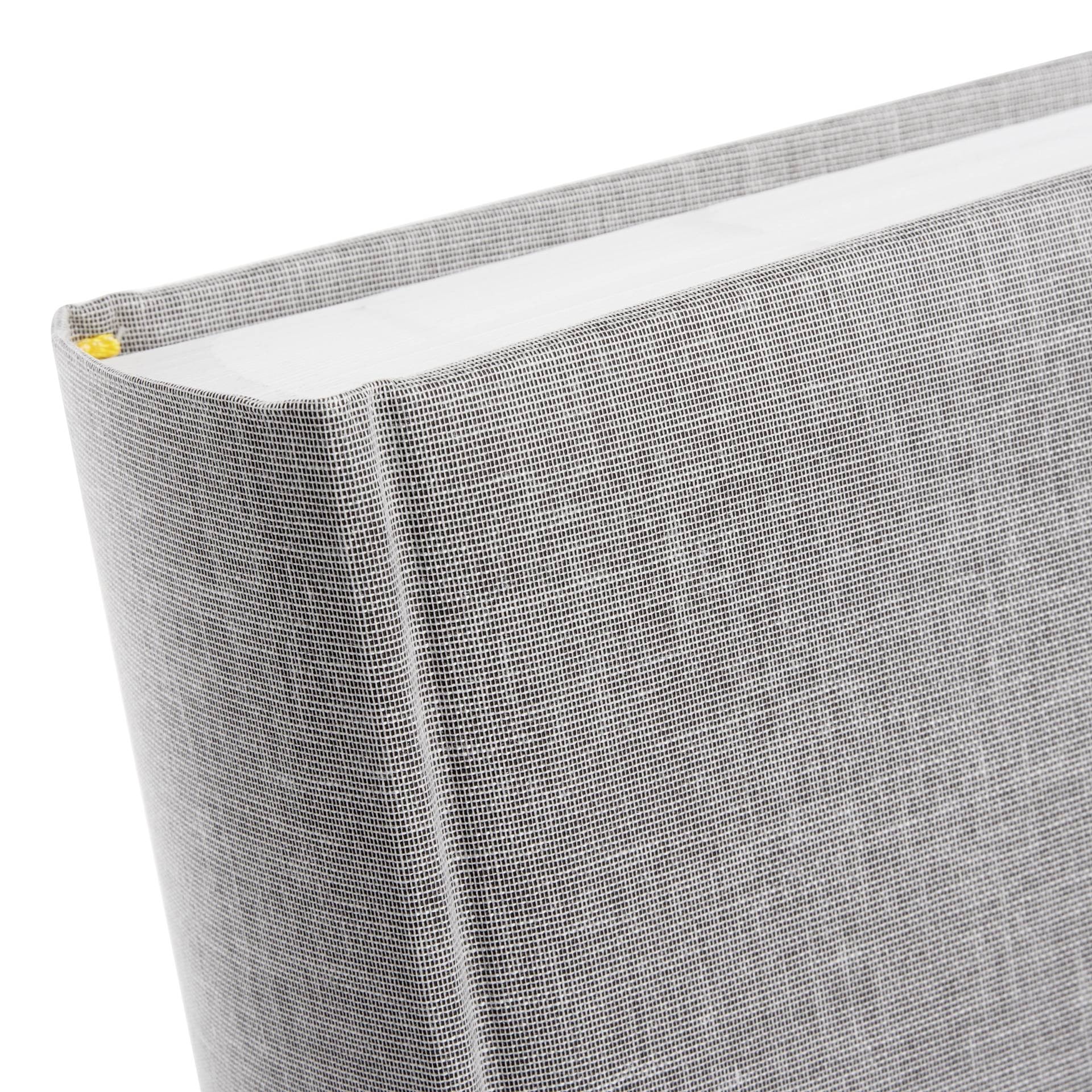 An elegant Goldbuch photo album with grey linen pattern, suitable for adding charm to a photo album collection.