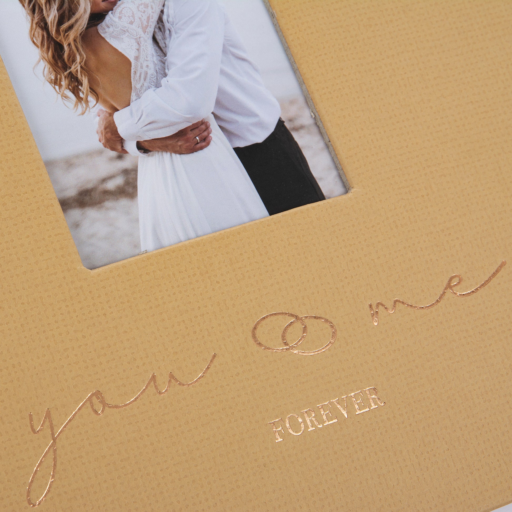 A Goldbuch photo album with a cover illustration of a couple in love, showcasing its hardcover design and white pages.