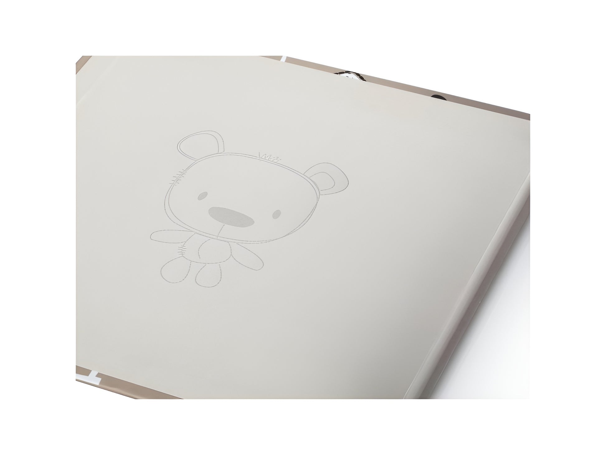 A white page of the Photo Album featuring a drawing of a teddy bear, displayed on the inner cover of a Hama Photo Album.