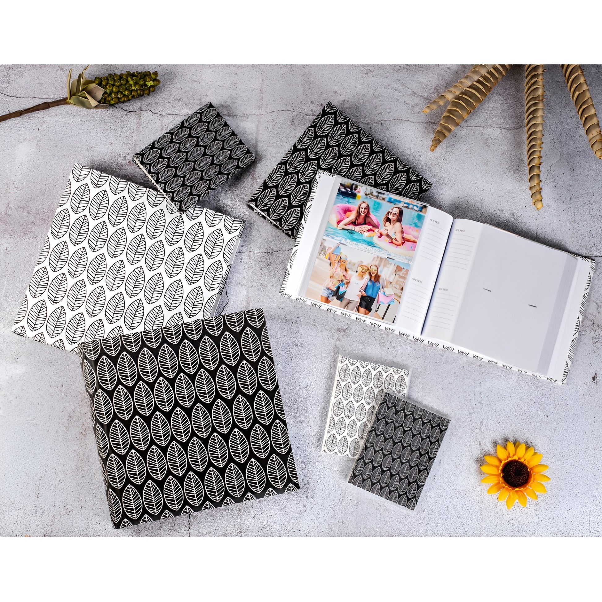 A Hama photo album with an elegantly presented white and black leaf pattern.