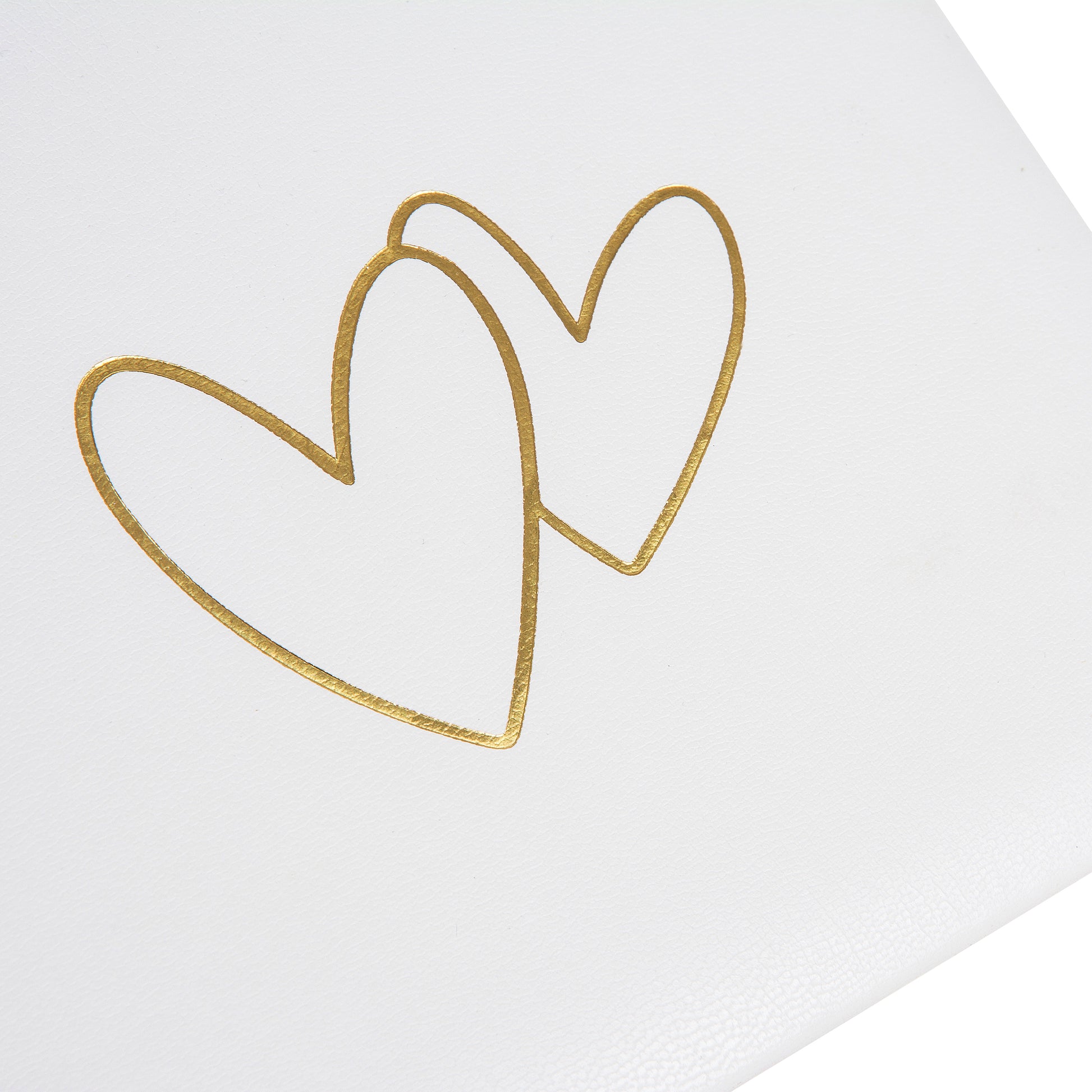 Goldbuch photo album with an elegant white cover, decorated with stylish golden hearts