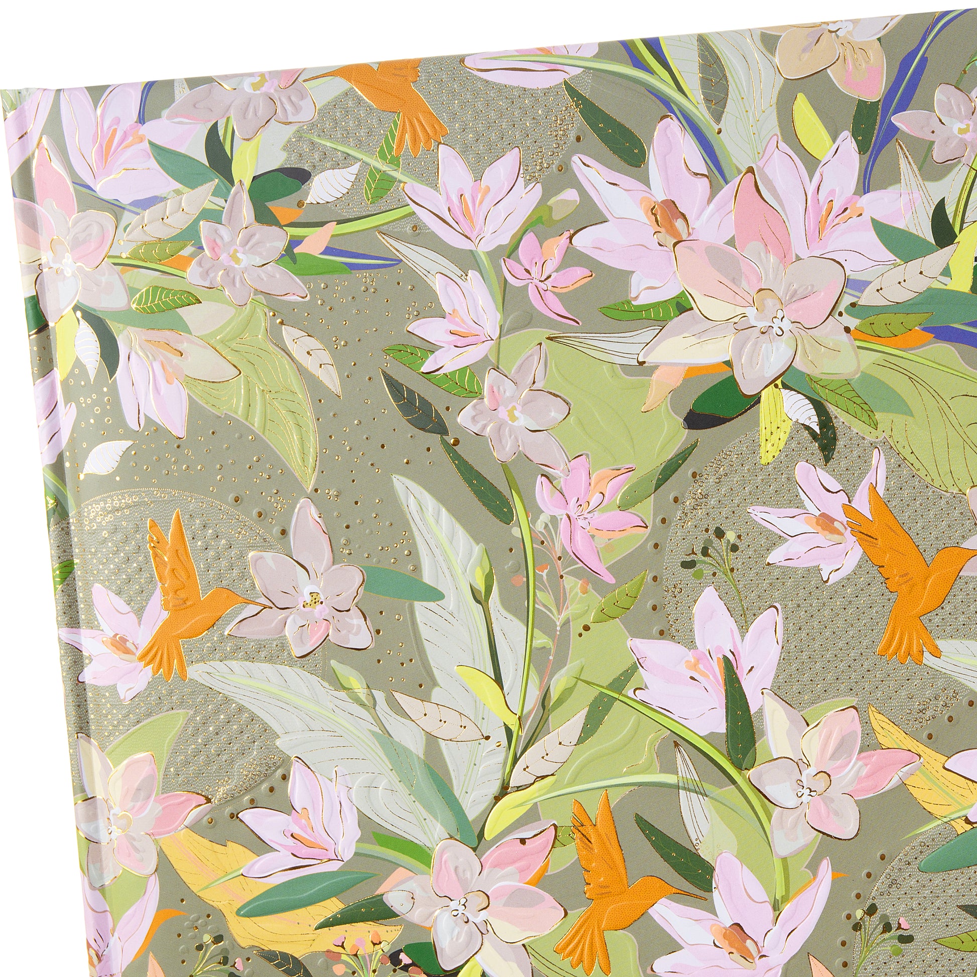A green Goldbuch photo album with floral patterns and birds