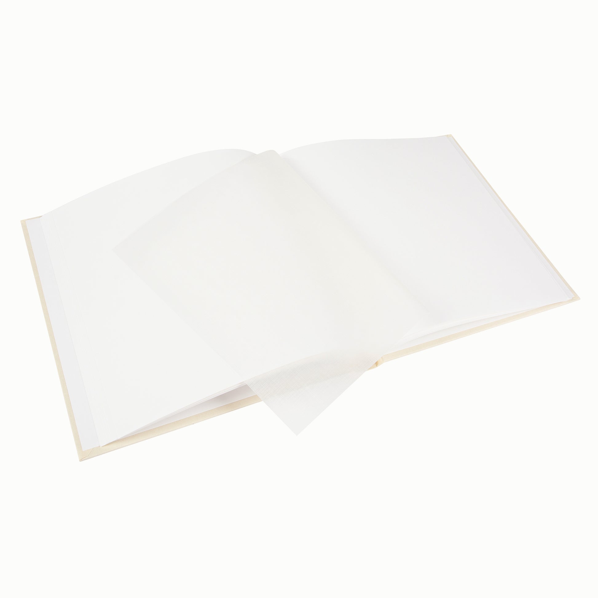 A Goldbuch photo album with three photographs showcased on its surface.
