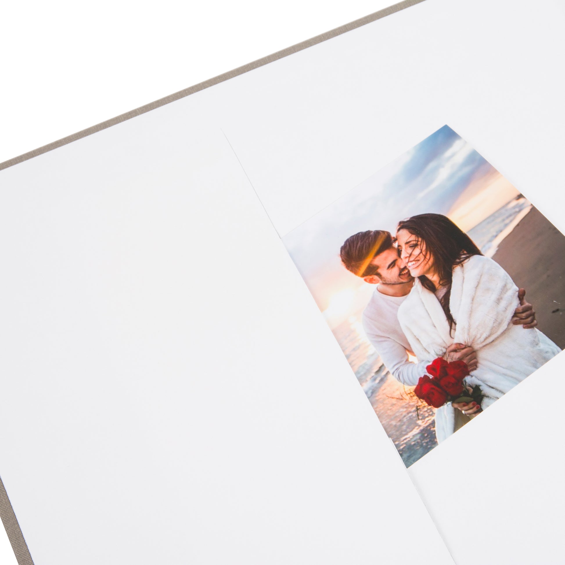 Grey Goldbuch photo album with cut-out sections displaying images of the Eiffel Tower and other scenes.