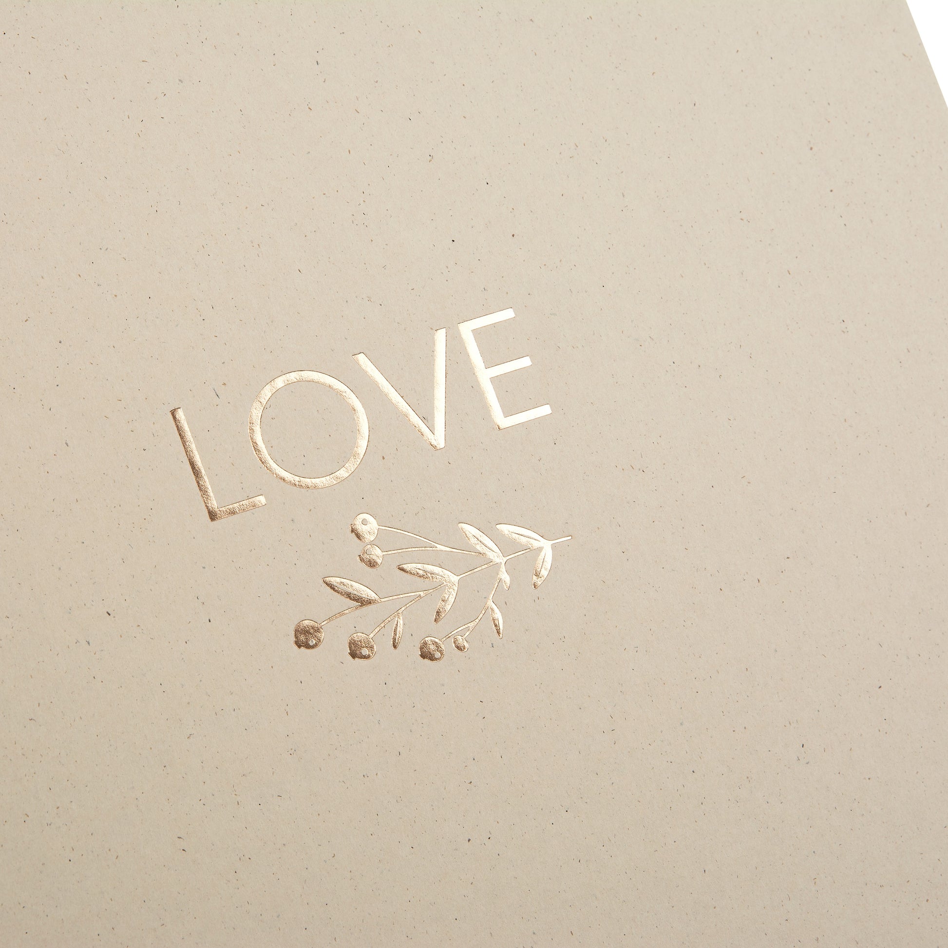 A rustic Goldbuch photo album with the word "Love" on the cover, perfect for preserving special moments.