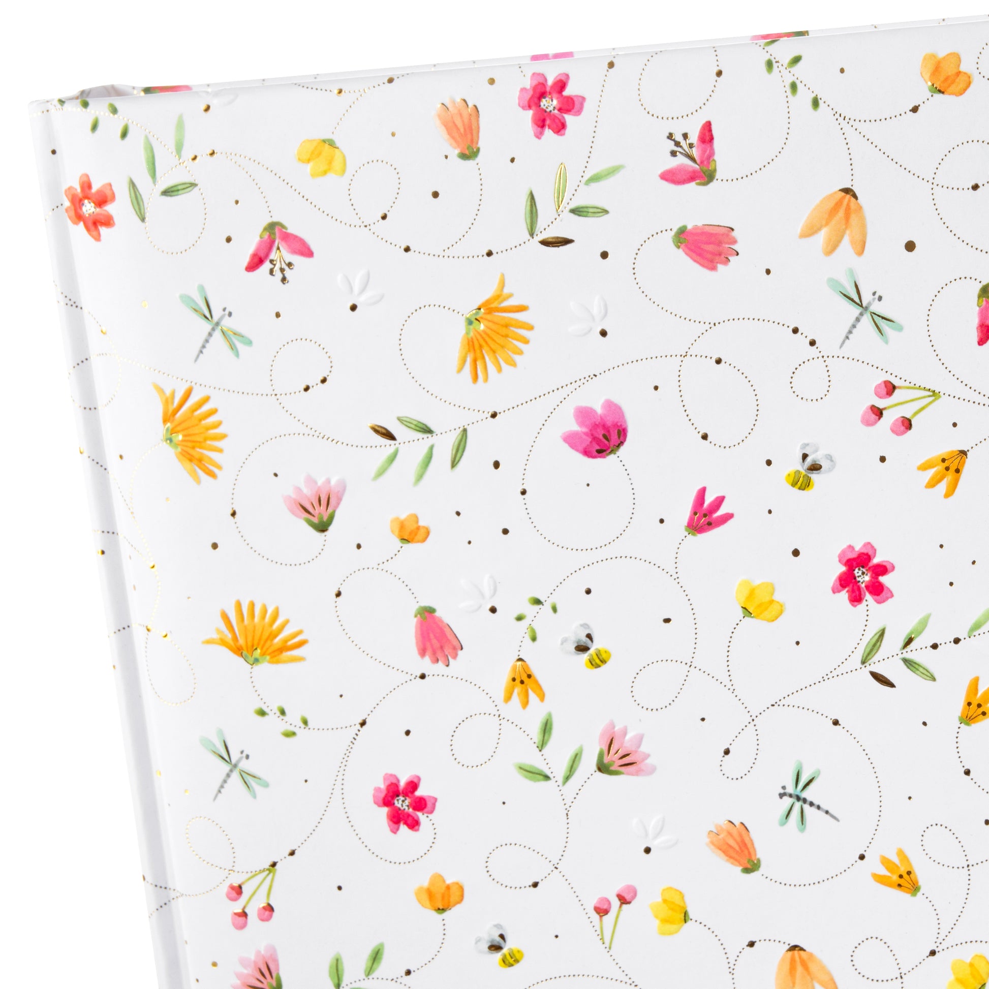 A white Goldbuch photo album adorned with colorful flowers and butterflies on the cover.