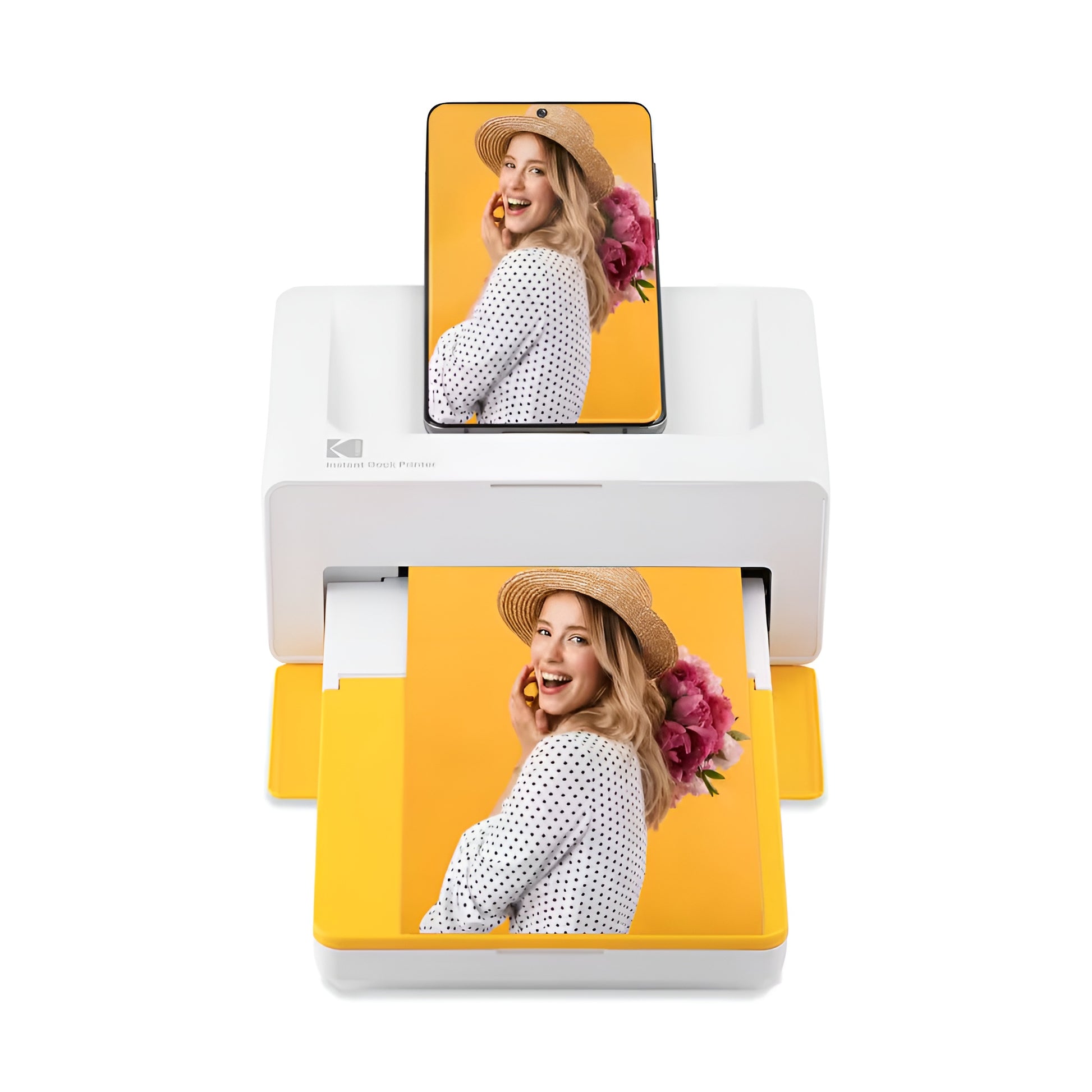 A woman displays a photo just printed from a Kodak instant printer, highlighting the joy of instant photography.