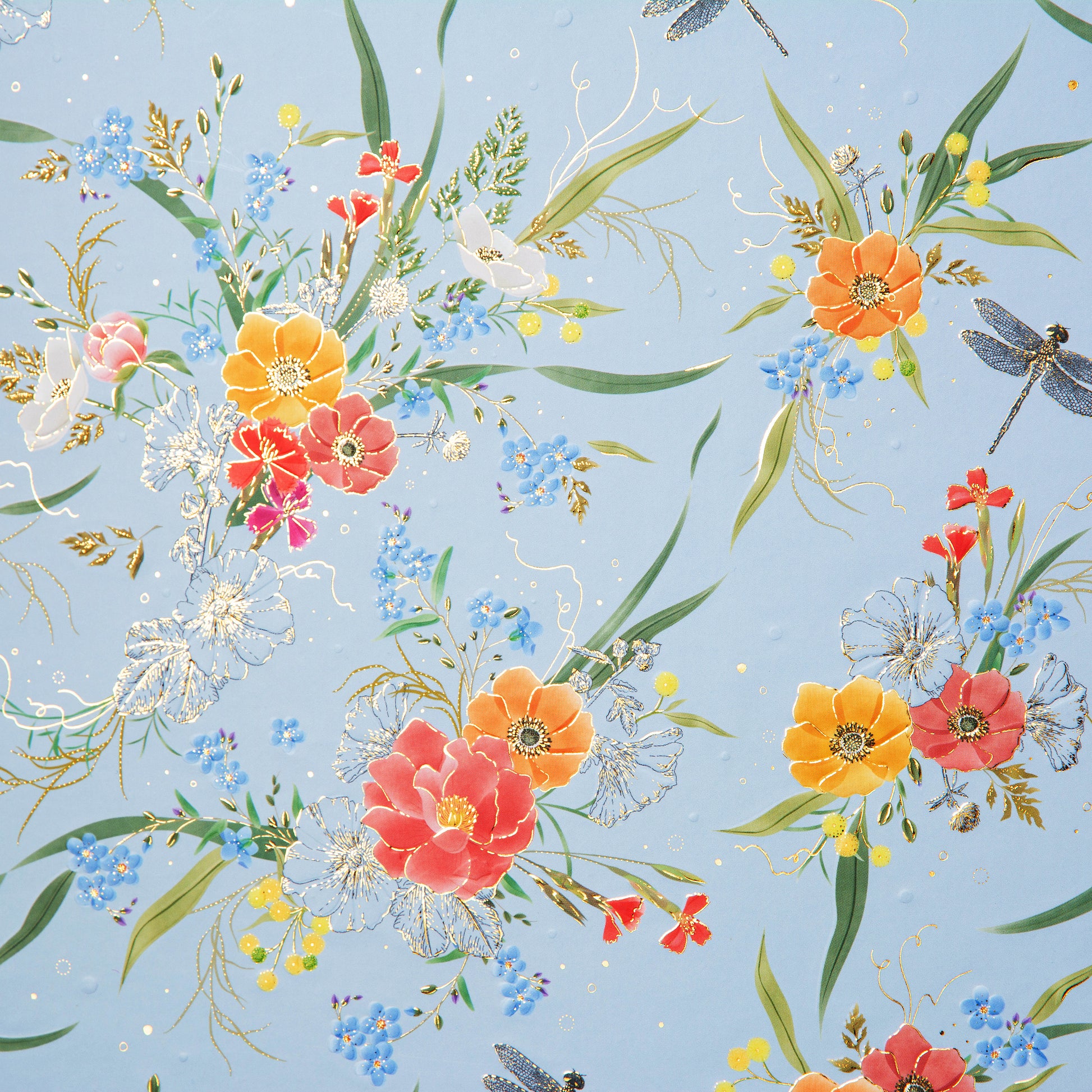 A Goldbuch photo album with a flower illustration on a light blue cover, showcasing its hardcover design and white pages.