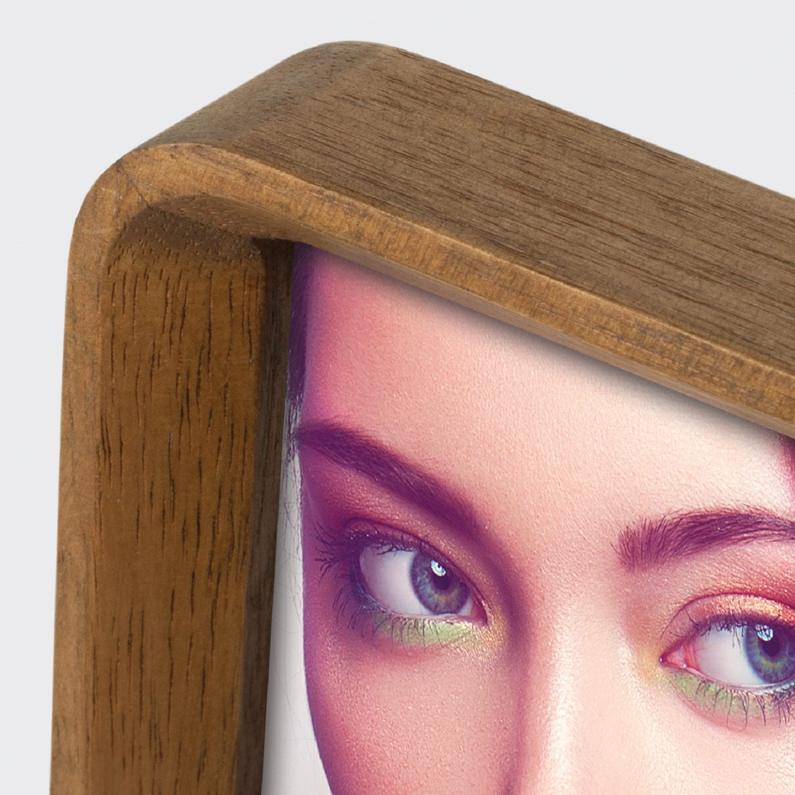 A ZEP wooden photo frame displaying a portrait of a woman, elegantly showcasing her image.
