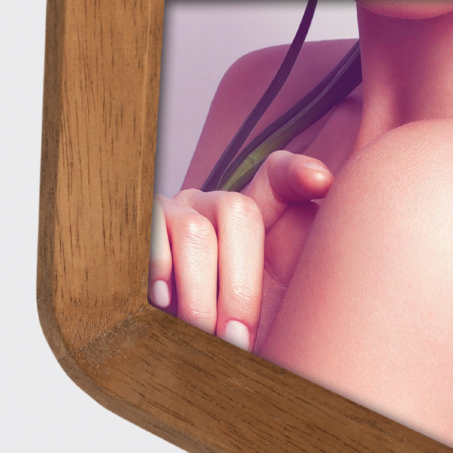 A ZEP wooden photo frame displaying a portrait of a woman, elegantly showcasing her image.