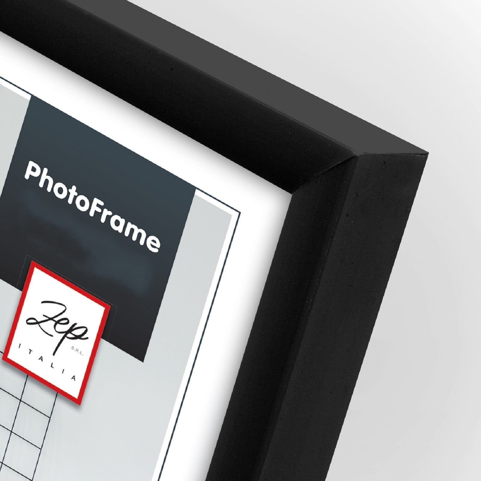 A black Zep basic photo frame showing a frame on a desk, accompanied by a chair, illustrating a neat and organized work area.