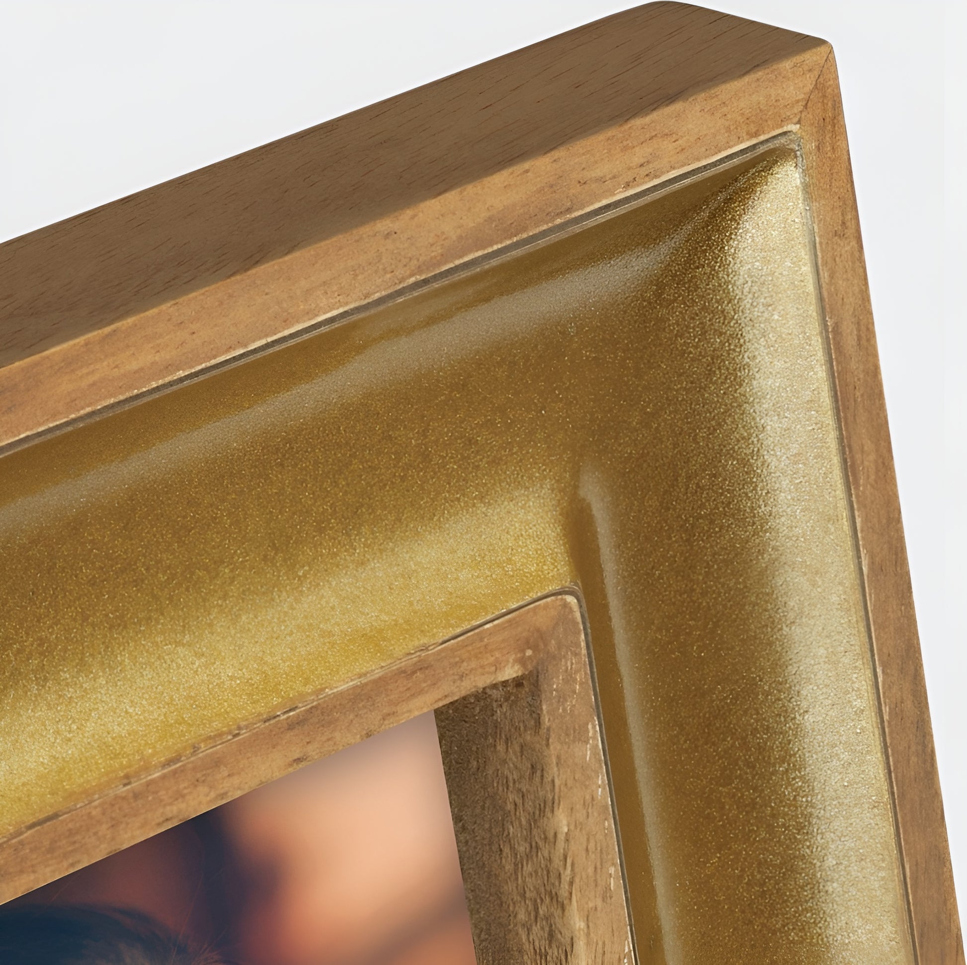 A ZEP golden photo frame displaying a beautiful woman elegantly dressed, capturing a moment of grace and style.