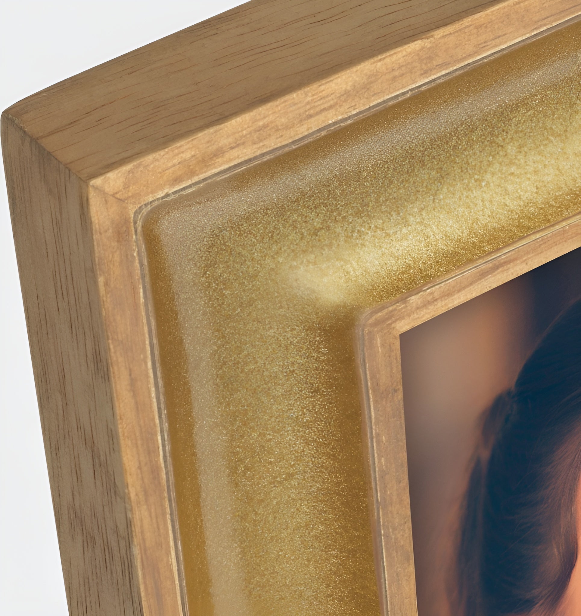 A ZEP golden photo frame displaying a beautiful woman elegantly dressed, capturing a moment of grace and style.