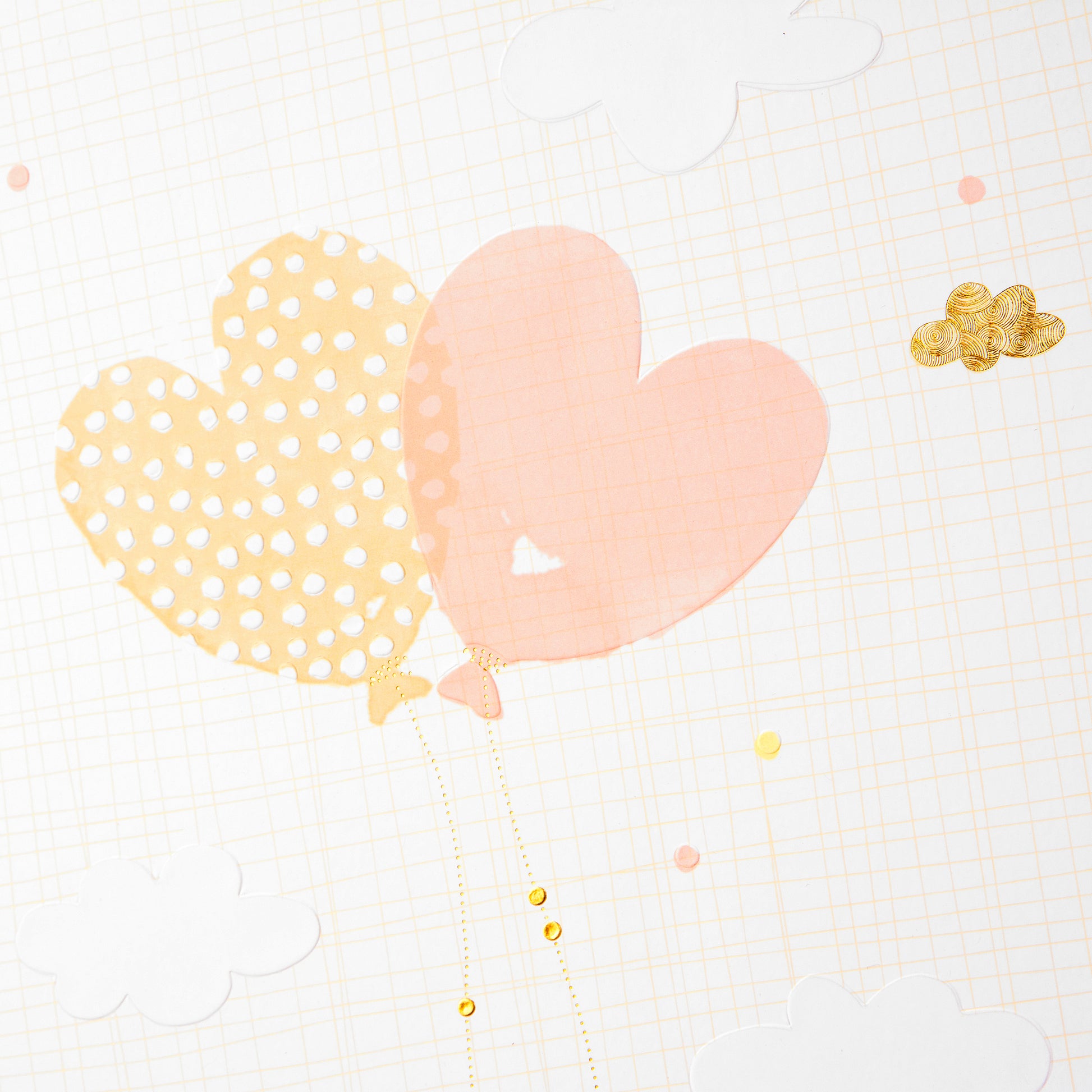 A Goldbuch white photo album with heart shaped balloon design, decorated with golden clouds, ideal for your treasured moments.