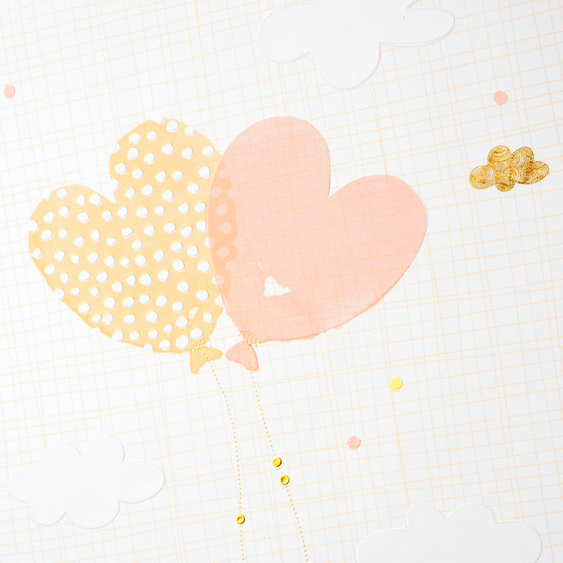 A Goldbuch white photo album with heart shaped balloon design, decorated with golden clouds, ideal for your treasured moments.