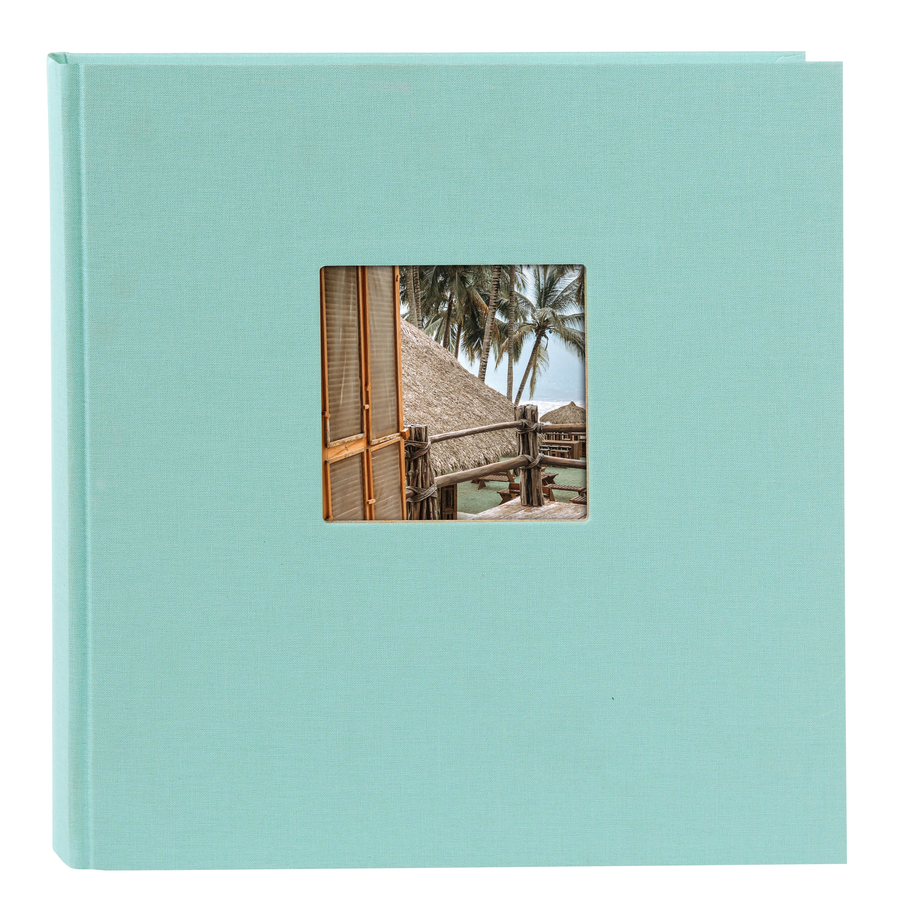A Goldbuch aqua blue photo album with a cover illustration of a beach house, showcasing its hardcover design and black pages.