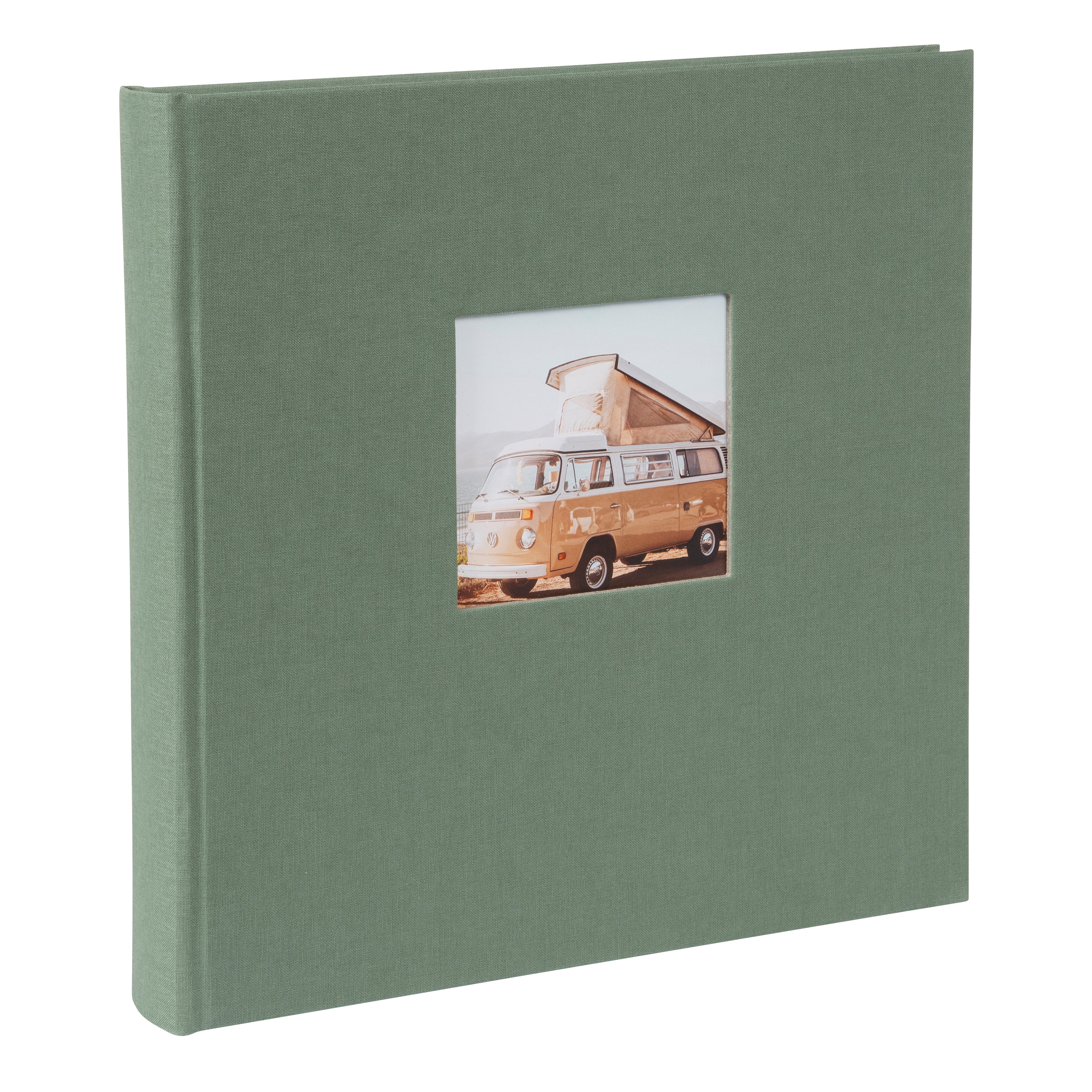A green Goldbuch photo album in focus, with a retro van visible in the background, representing a blend of memories and exploration.
