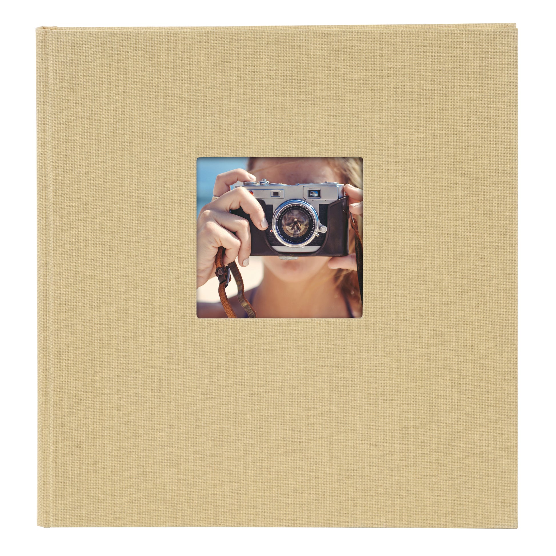 A Goldbuch beige photo album with a cover illustration of a girl taking photos showcasing its hardcover design and black pages.