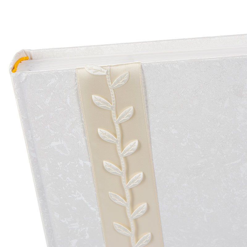 A stylish white Goldbuch photo album with a luxurious gold leaf design, perfect for preserving cherished memories.