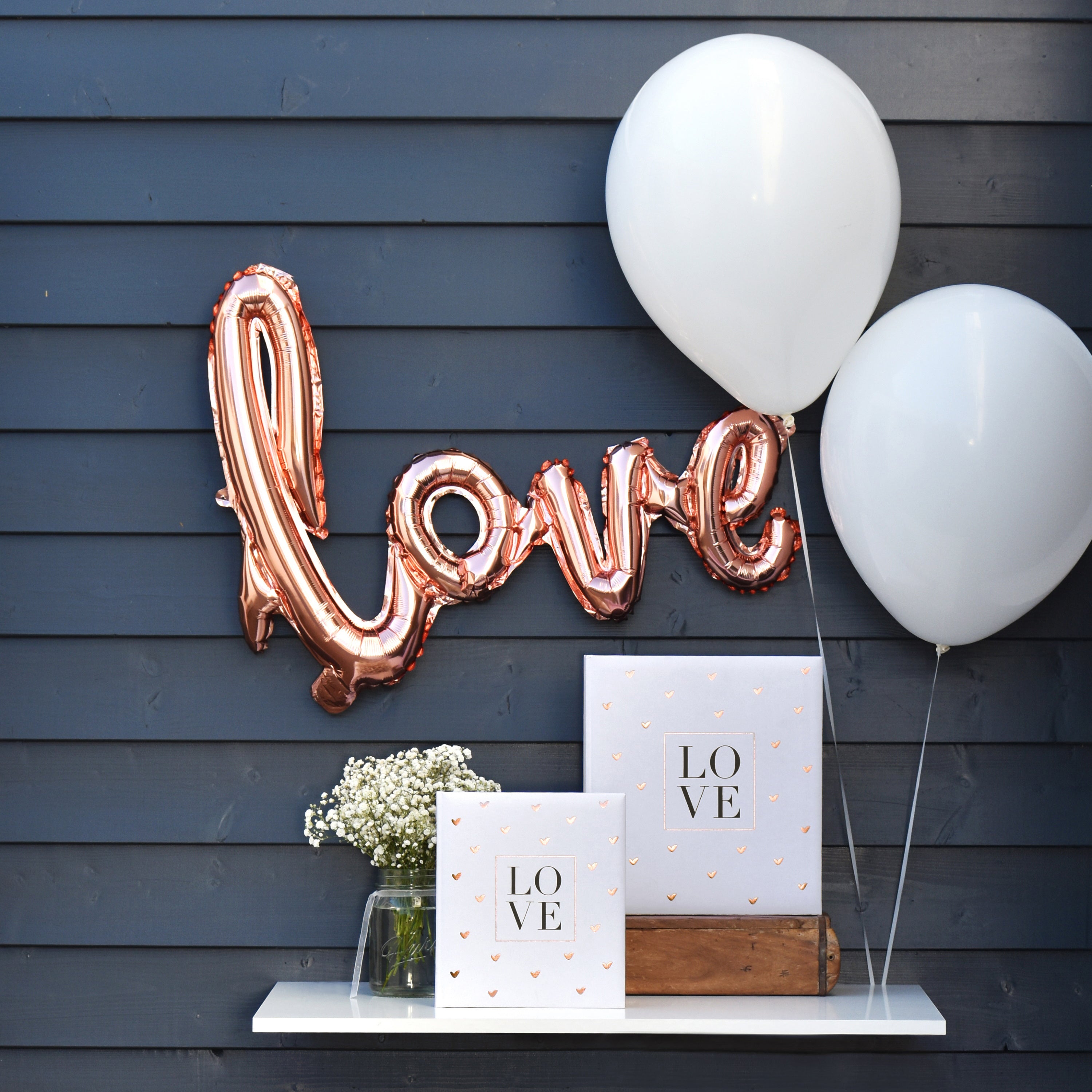 A white Goldbuch wedding photo album with a heart-shaped design pattern, symbolizing love and celebration.