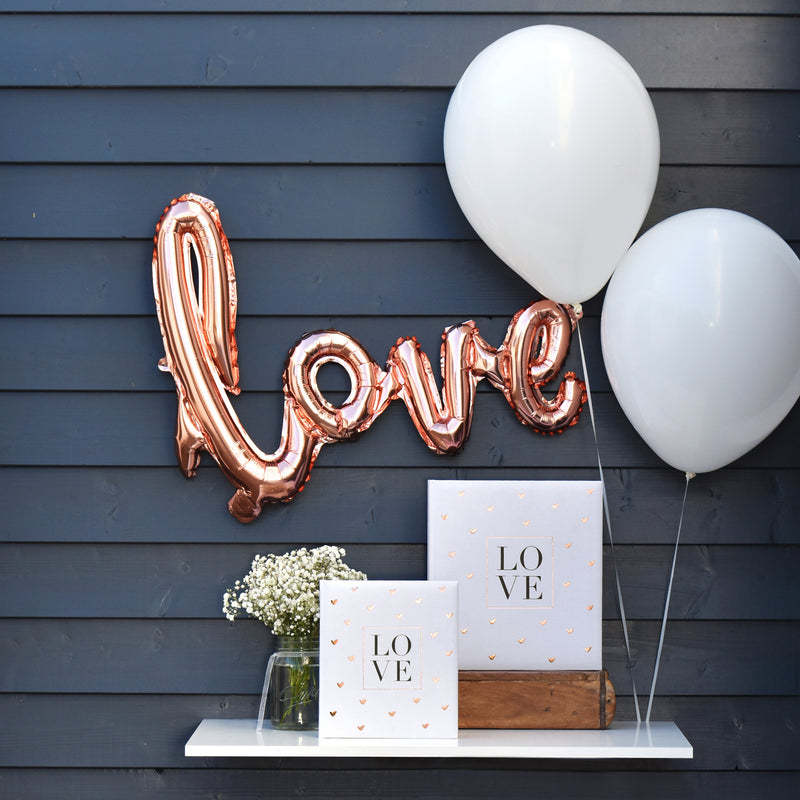 A white Goldbuch wedding photo album with a heart-shaped design pattern, symbolizing love and celebration.