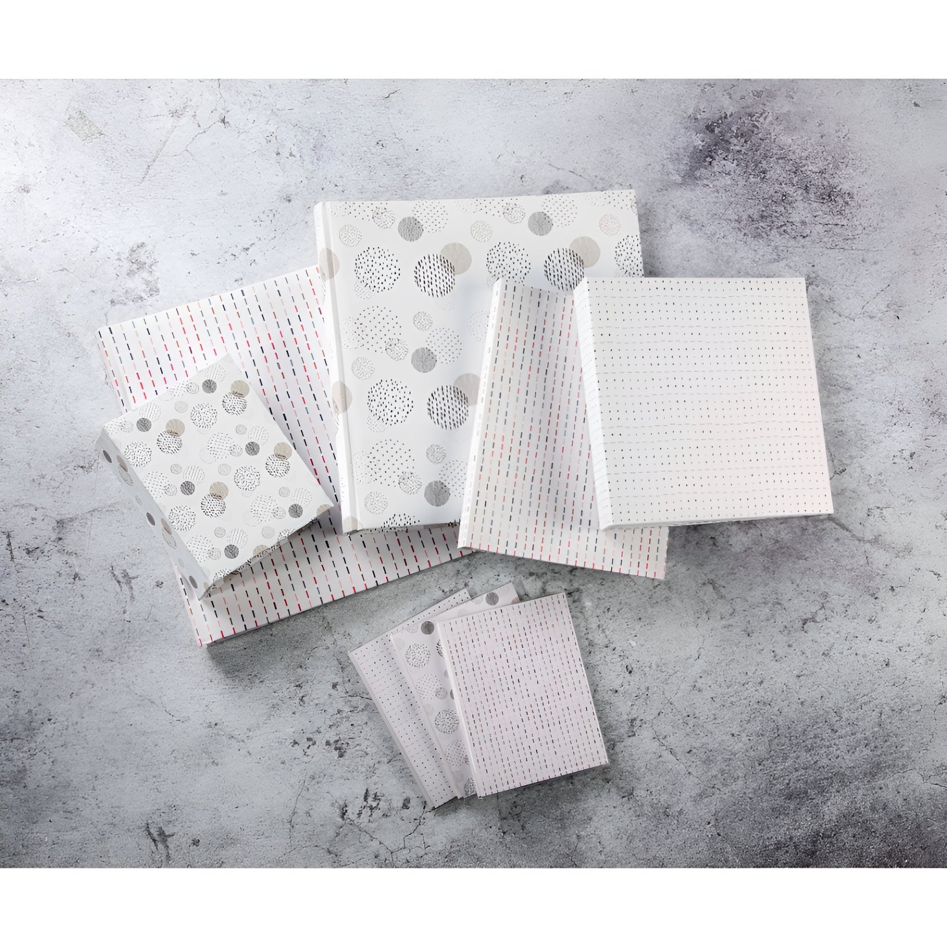 A Hama jumbo photo album featuring a square patterned fabric, highlighting its graphic square design.