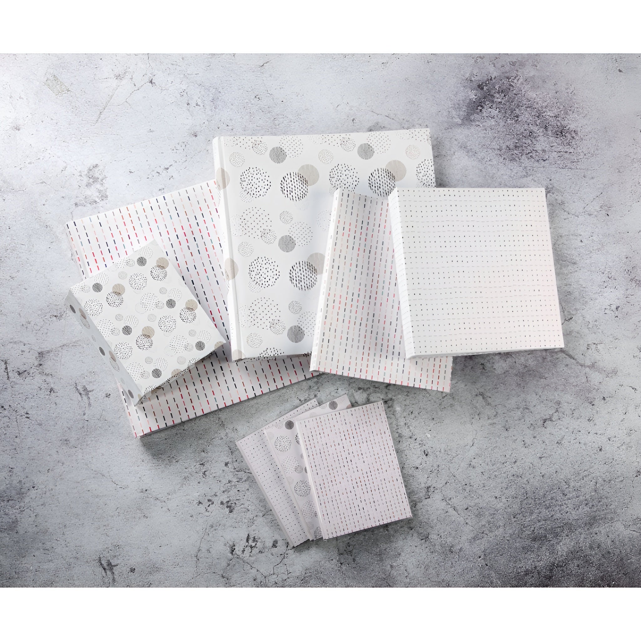 A Hama jumbo photo album featuring a square patterned fabric, highlighting its graphic square design.