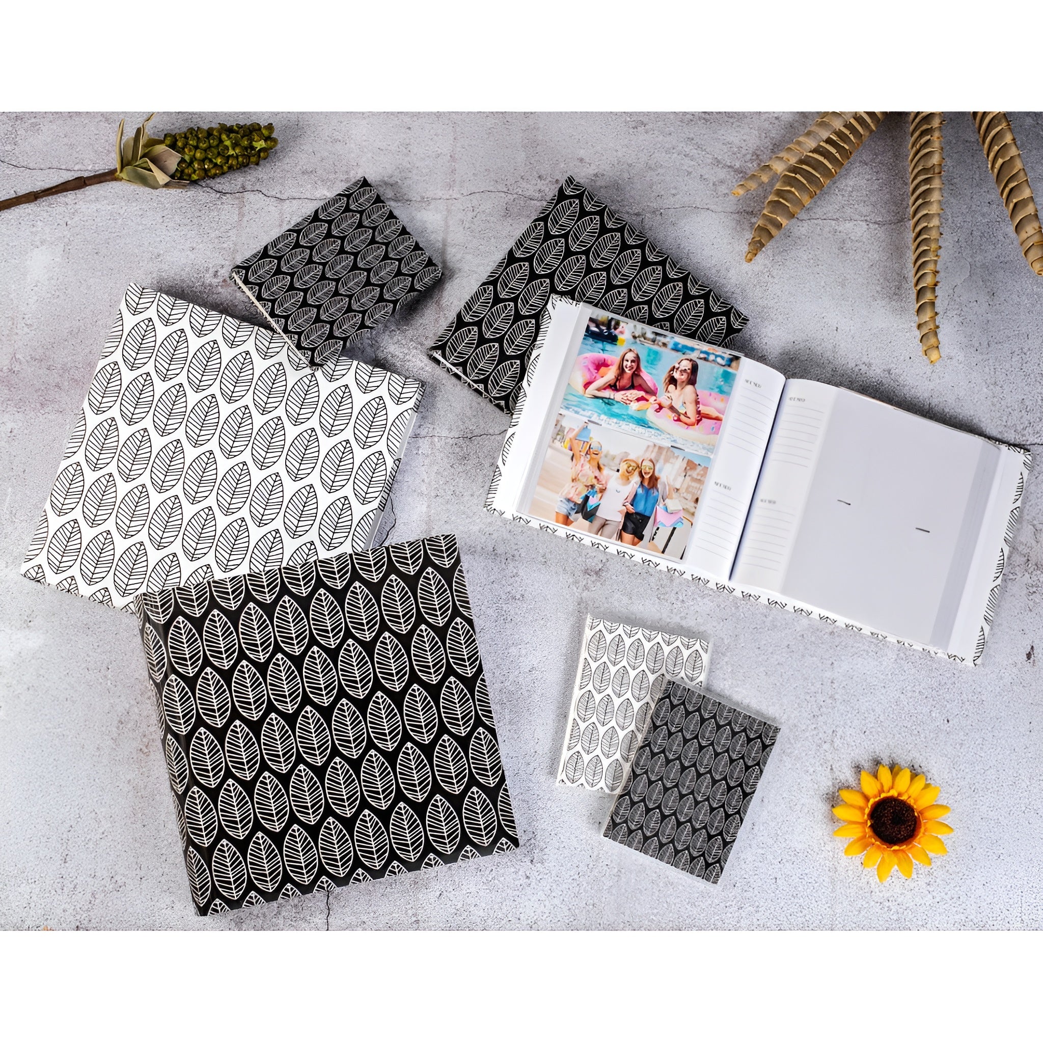 A Hama photo album with an elegantly presented white and black leaf pattern.