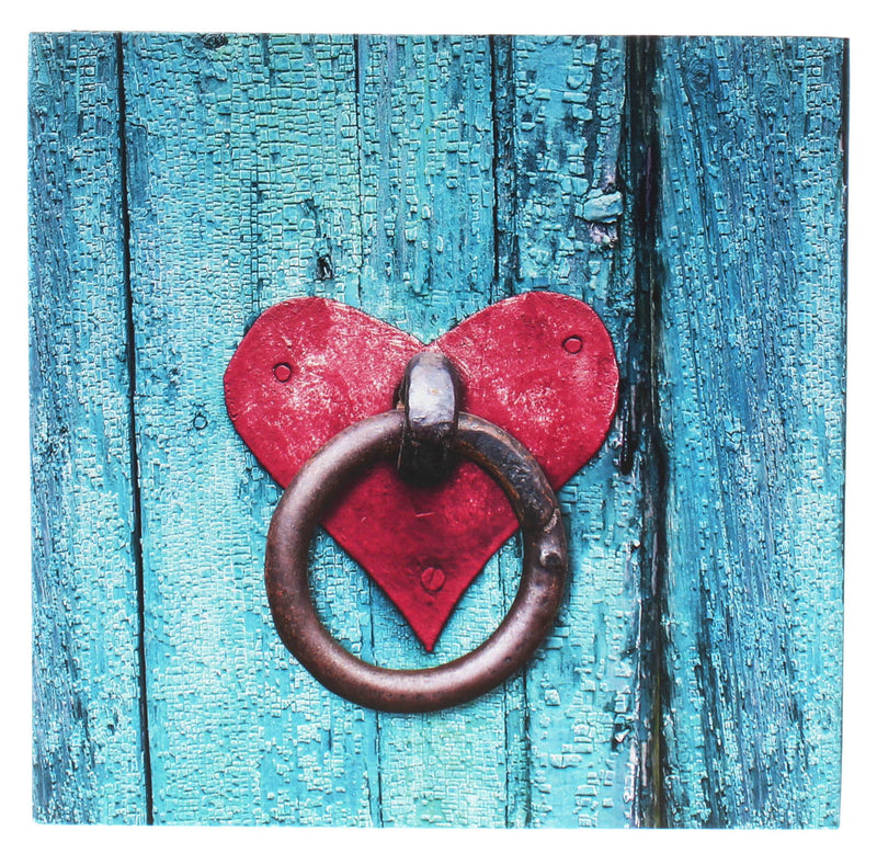 A Hama Photo album with red heart-shaped door knocker on a blue door, showcasing unique home decor.