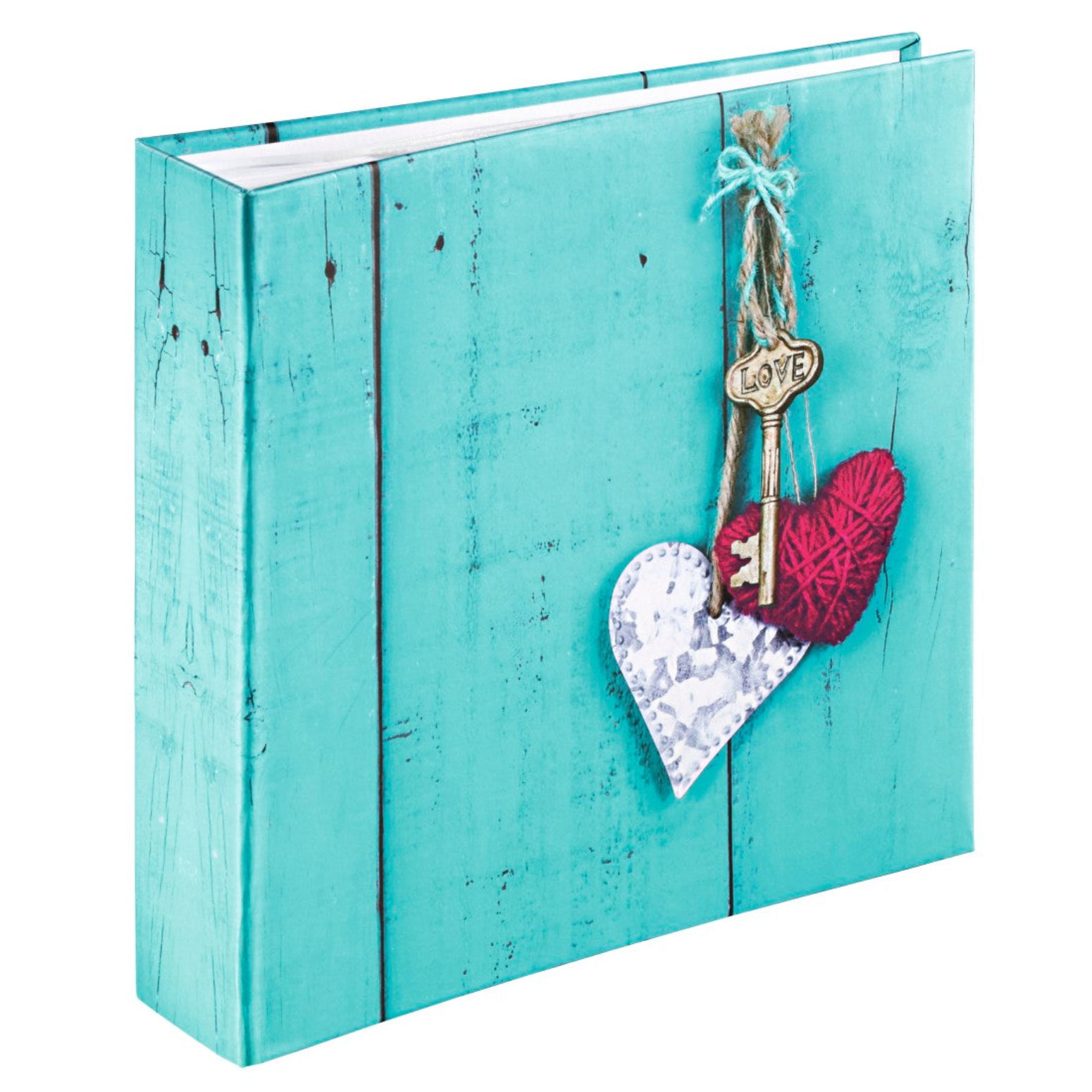 A wooden heart and key are displayed on a blue background, representing cherished moments on a Hama photo album.
