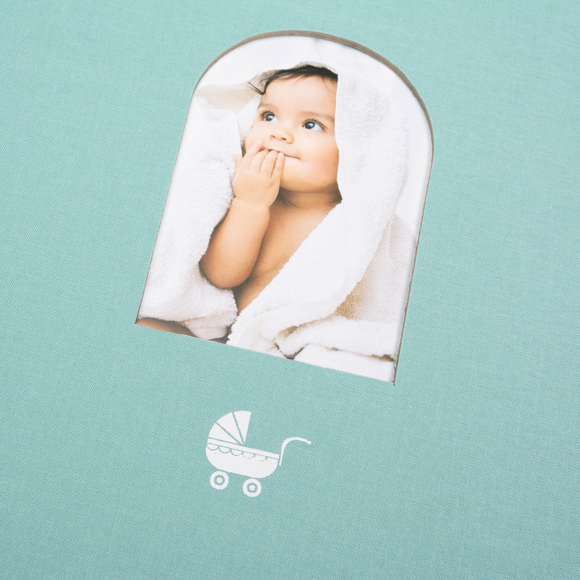 Light blue Goldbuch photo album with a cutout featuring a baby, on a white background
