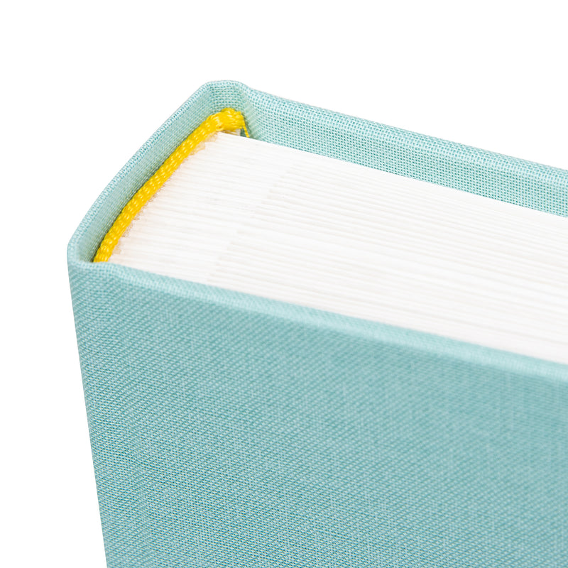 Light blue Goldbuch photo album with a cutout featuring a baby, on a white background