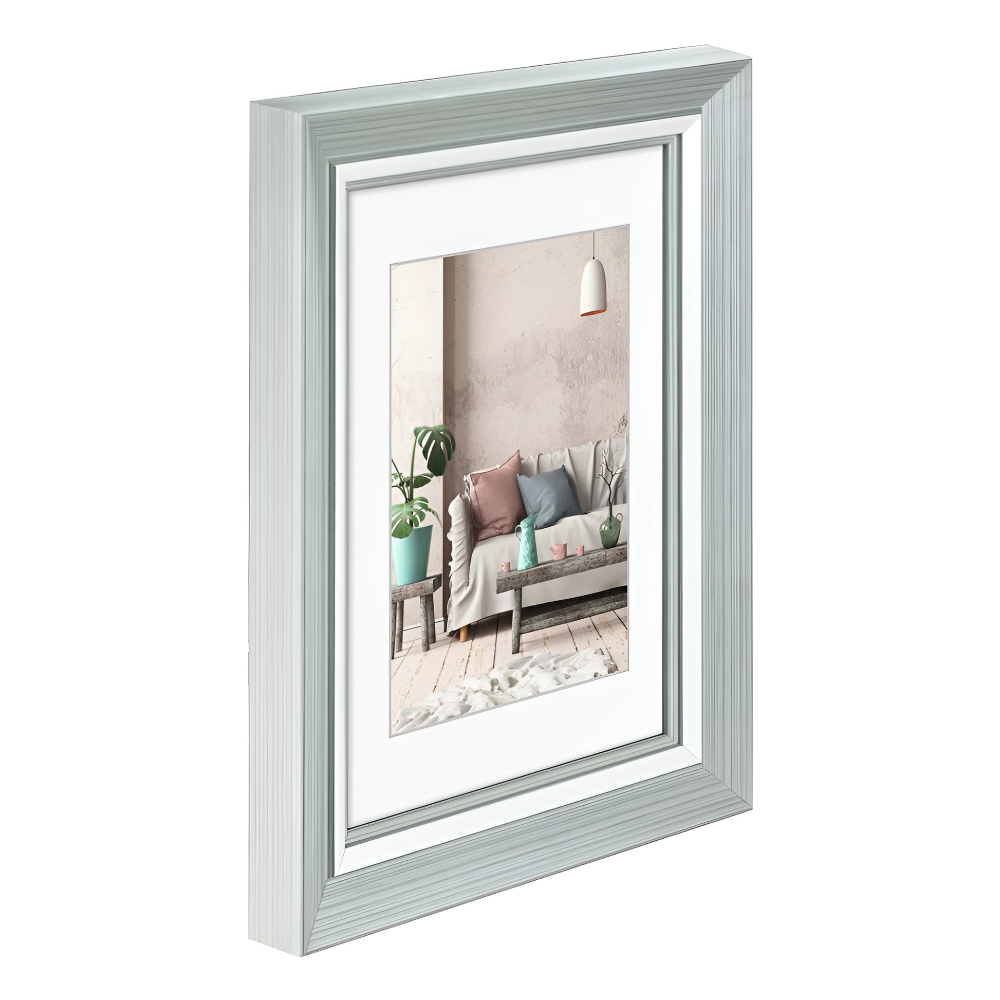 A Hama photo frame in white showcasing a picture of a comfortable couch, perfect for home styling.