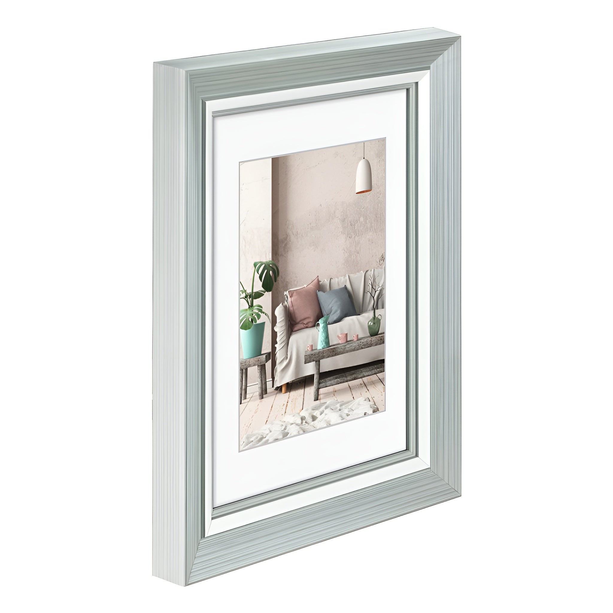 A Hama photo frame in white showcasing a picture of a comfortable couch, perfect for home styling.