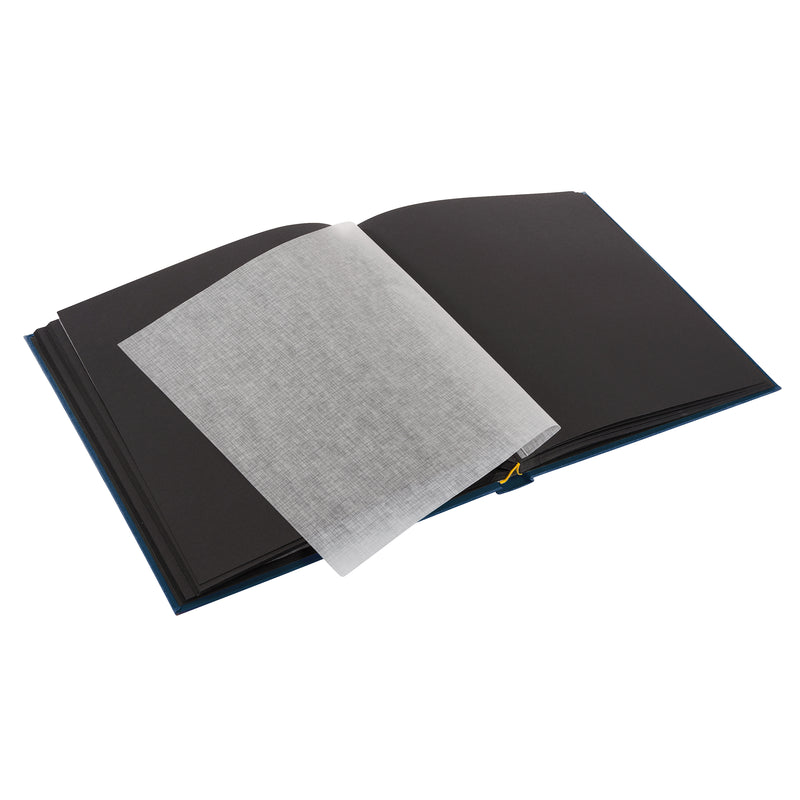 A Goldbuch blue photo album with a cover illustration of a woman cycling, showcasing its hardcover design and black pages.