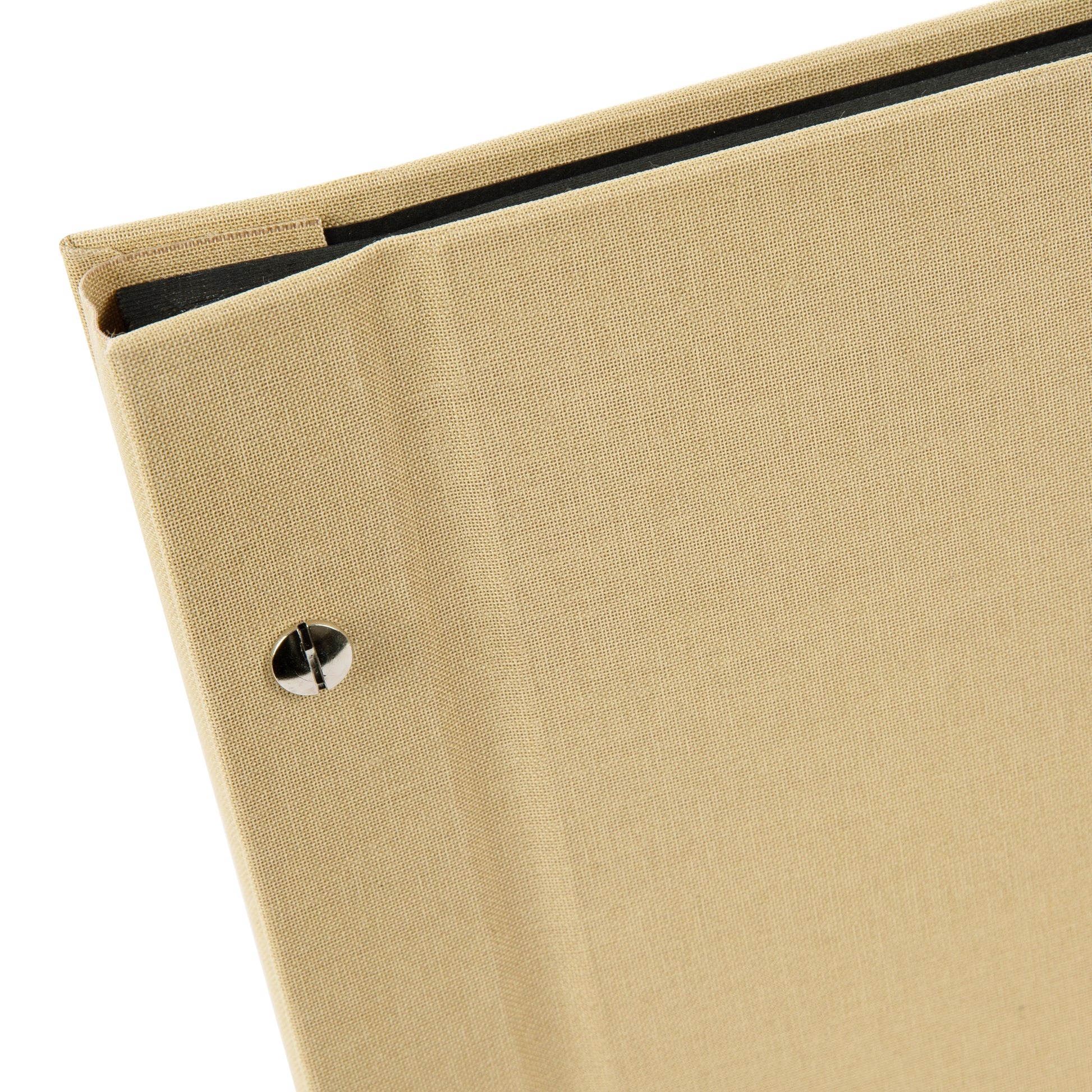 A Goldbuch beige photo album with a cover illustration of a woman taking photos, showcasing its hardcover design and black pages.