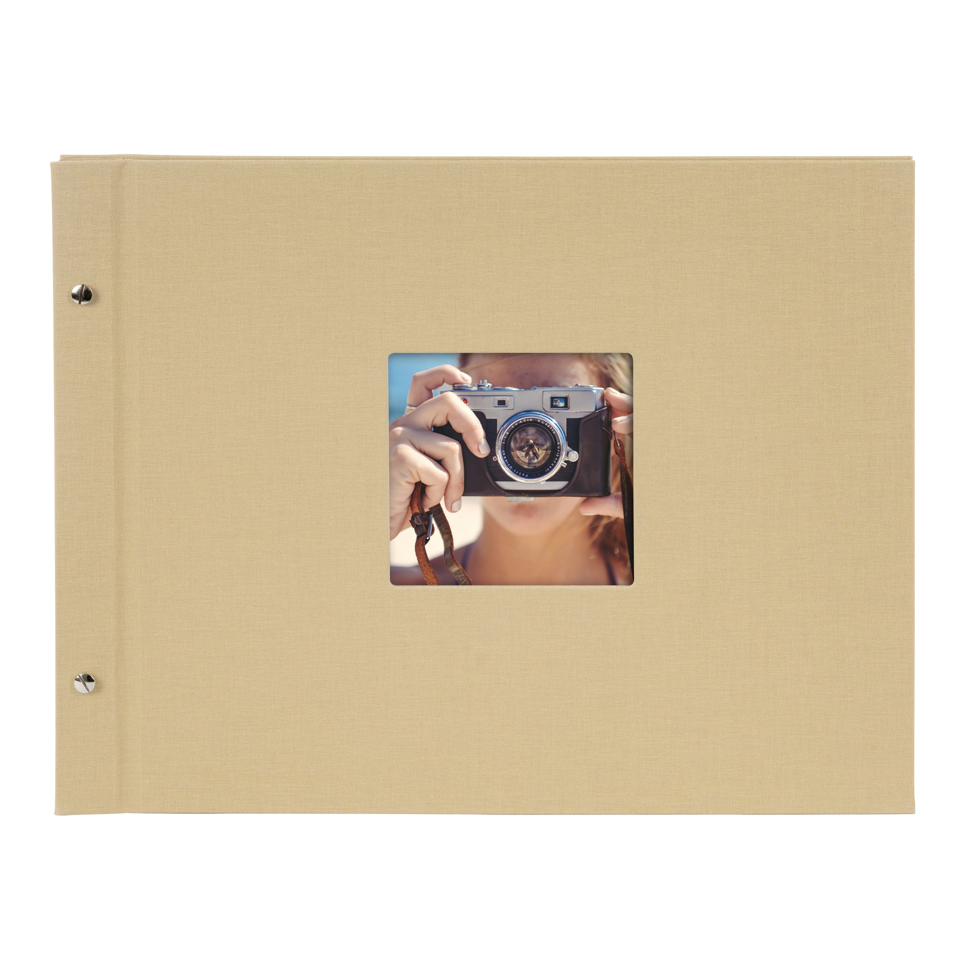 A Goldbuch beige photo album with a cover illustration of a woman taking photos, showcasing its hardcover design and black pages.