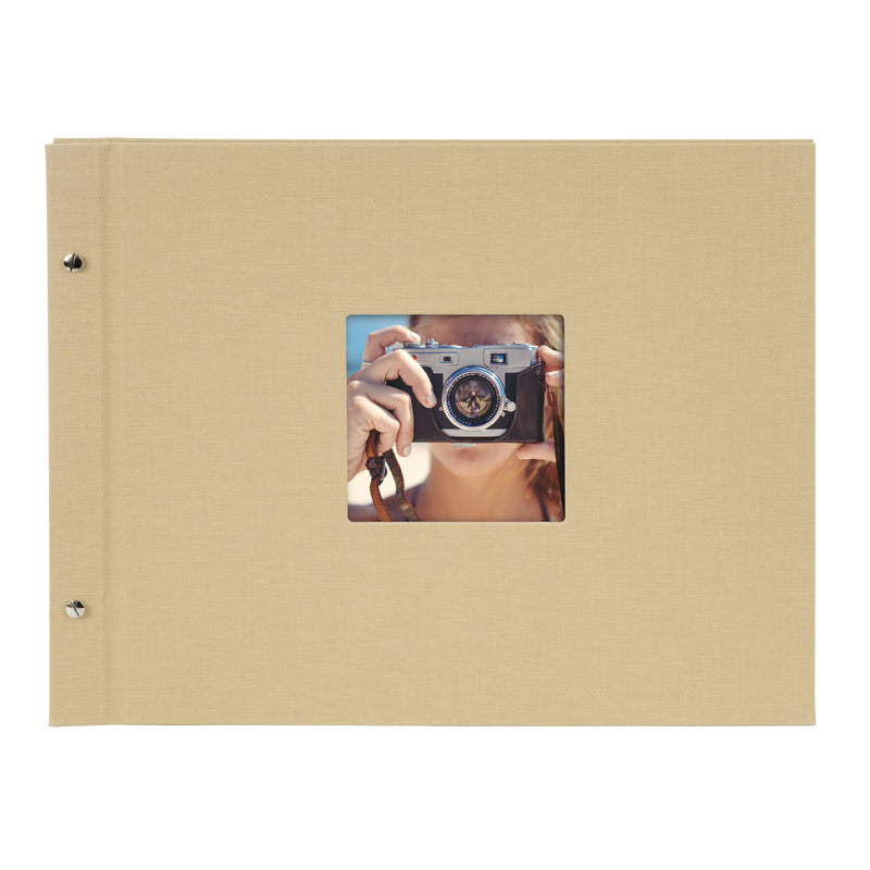A Goldbuch beige photo album with a cover illustration of a woman taking photos, showcasing its hardcover design and black pages.