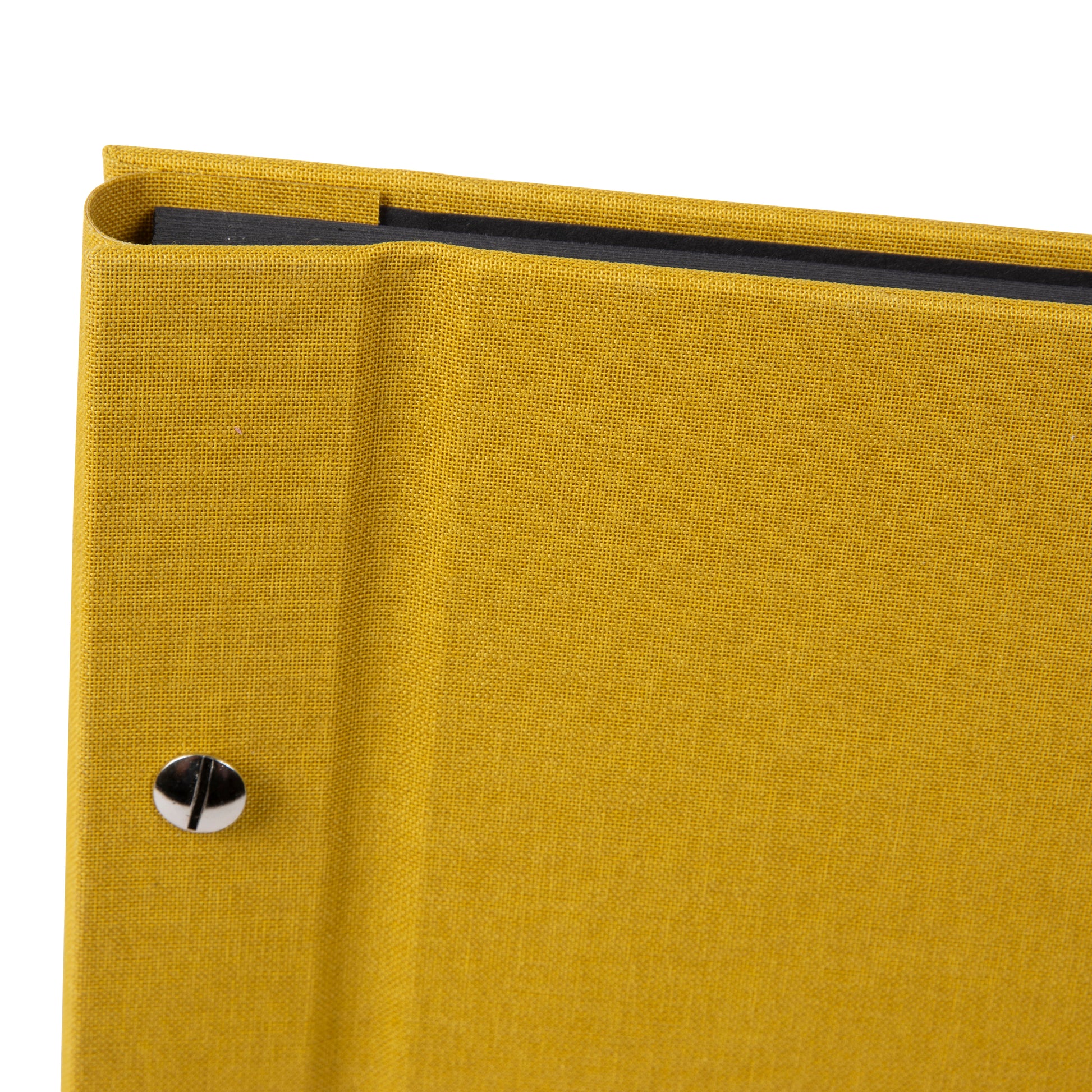 A Goldbuch mustard photo album with a cover illustration of a woman taking photos, showcasing its hardcover design and black pages.