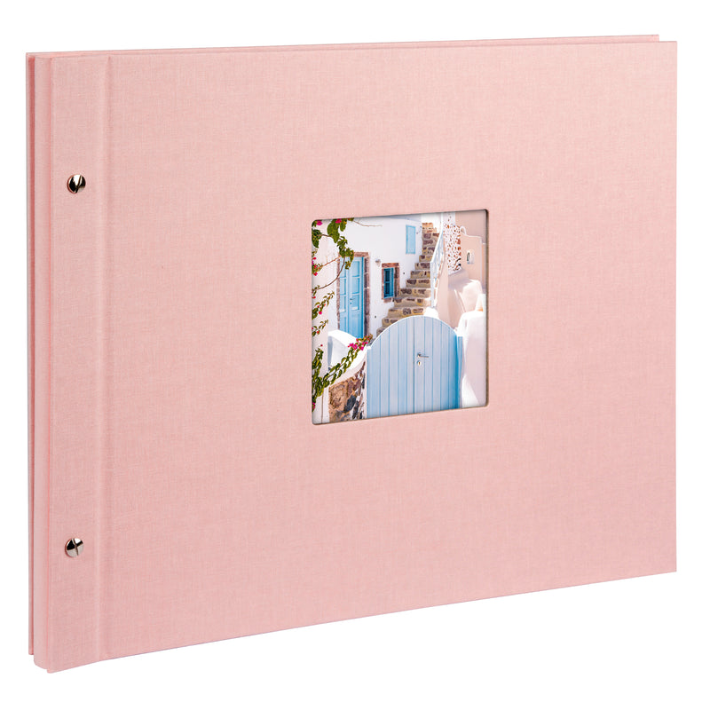 A Goldbuch rose photo album with a cover illustration of a blue wooden gate, showcasing its hardcover design and black pages.