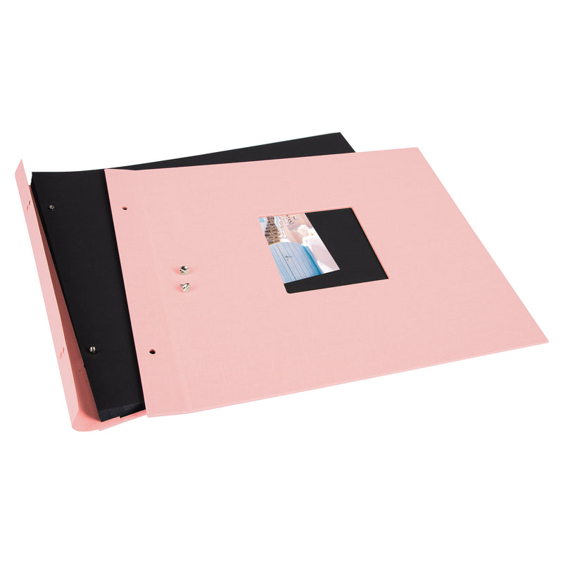A Goldbuch rose photo album with a cover illustration of a blue wooden gate, showcasing its hardcover design and black pages.