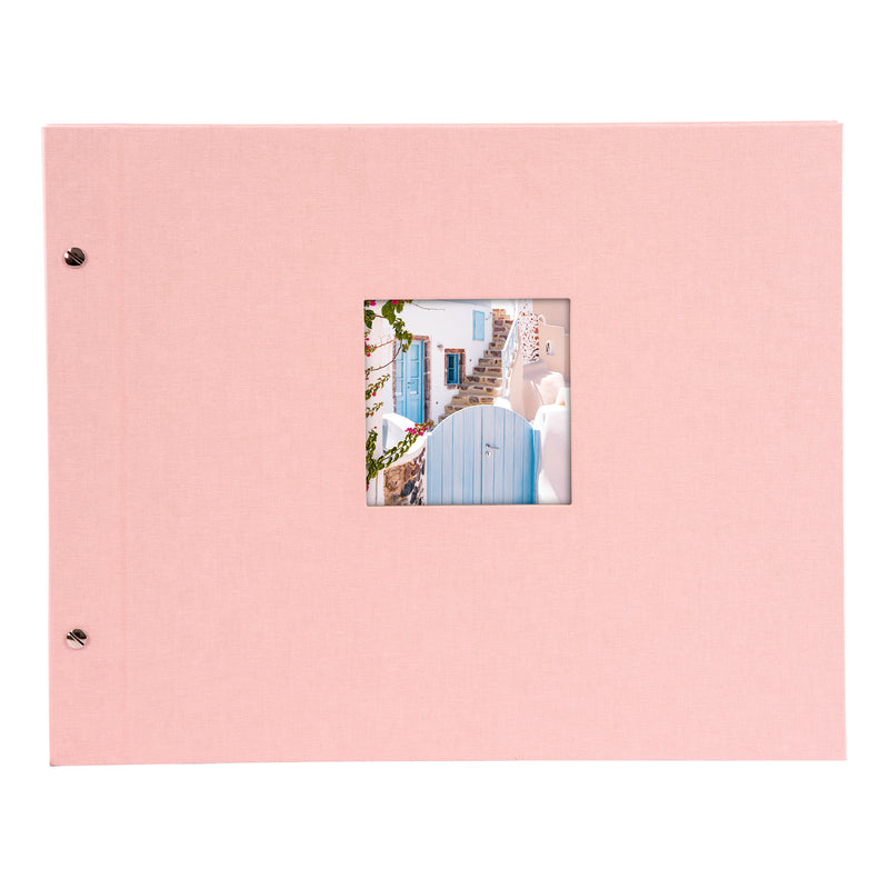 A Goldbuch rose photo album with a cover illustration of a blue wooden gate, showcasing its hardcover design and black pages.