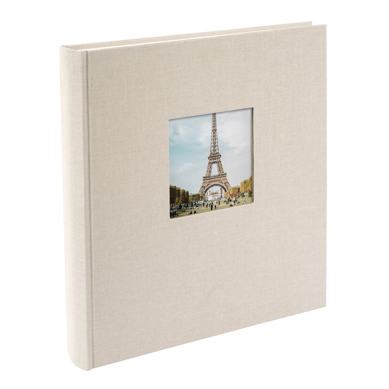 A Goldbuch sandgrey photo album with a cover illustration of the Eiffel tower, showcasing its hardcover design and white pages.