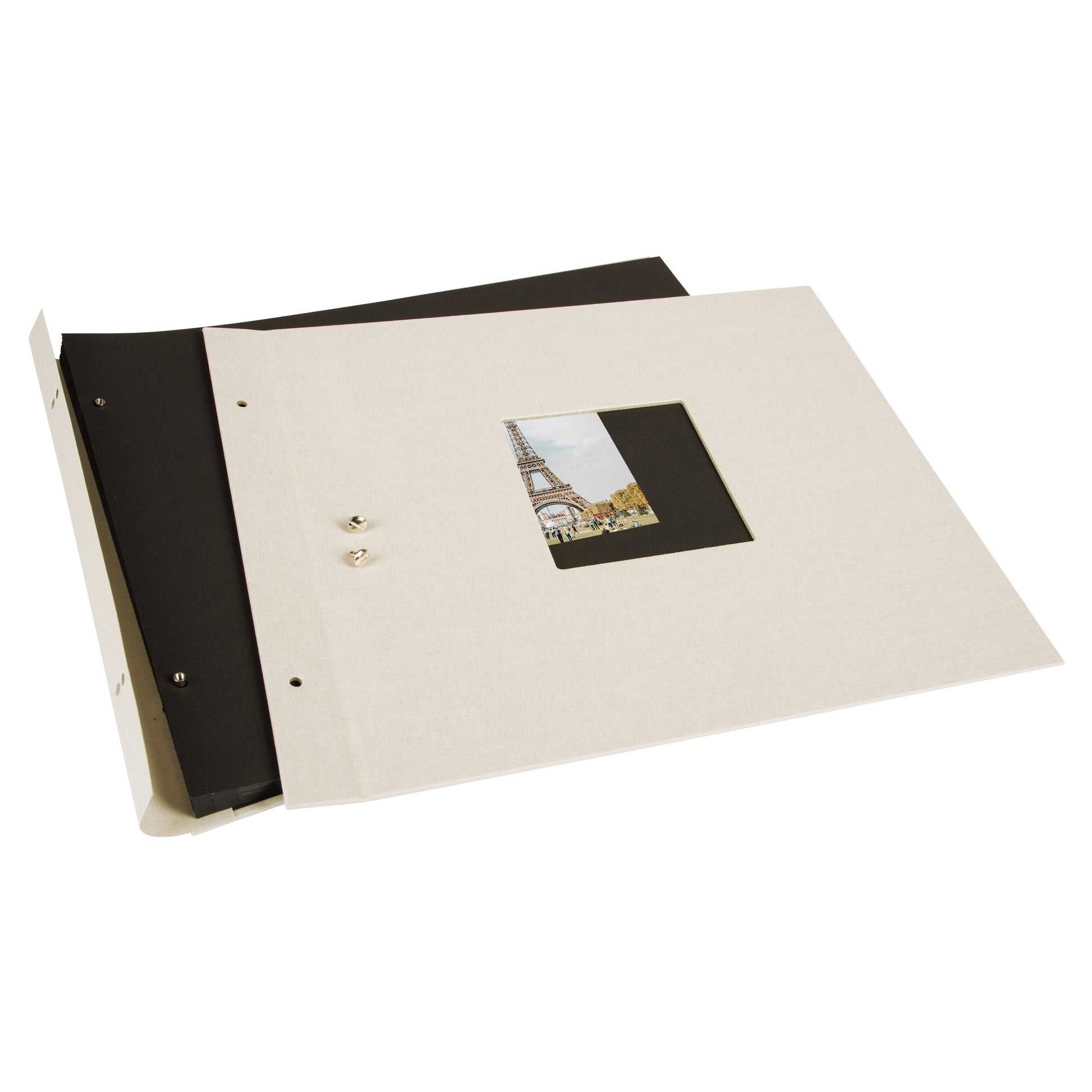 A Goldbuch sandgrey photo album with a cover illustration of the Eiffel tower, showcasing its hardcover design and black pages.