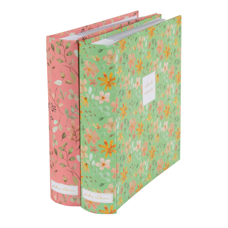 Goldbuch floral photo albums in pink and green, featuring a white label, arranged on a surface, resembling a photo album.