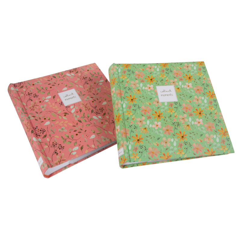 Goldbuch floral photo albums in pink and green, featuring a white label, arranged on a surface, resembling a photo album.