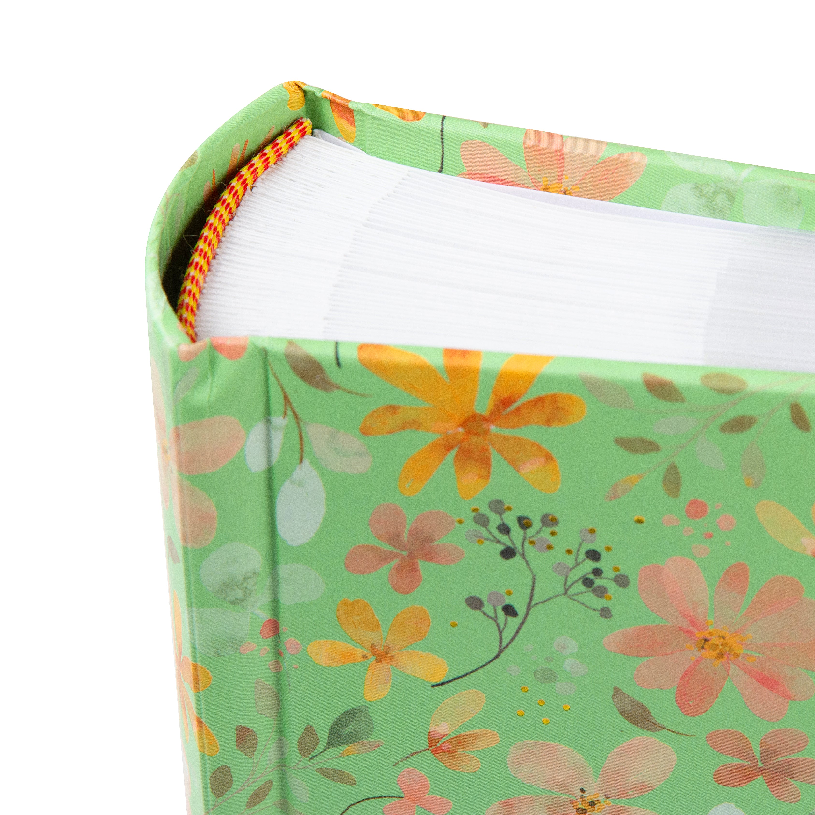 Goldbuch floral photo albums in pink and green, featuring a white label, arranged on a surface, resembling a photo album.
