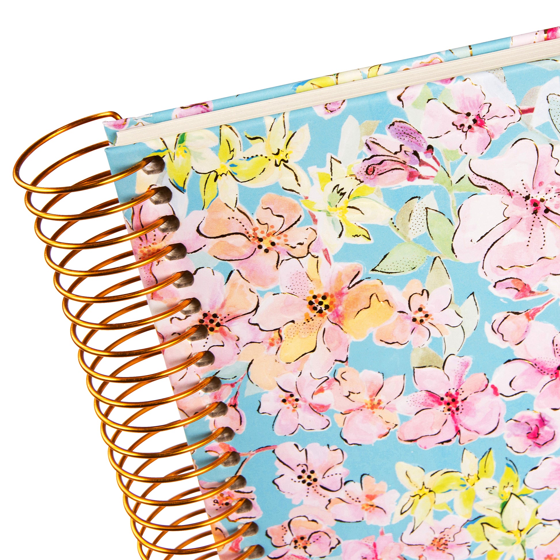 A spiral Goldbuch photo album, adorned with pink and blue flowers.

